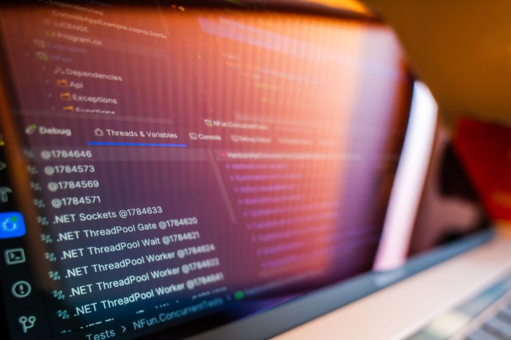 Focused view of a computer screen displaying code and debug information.